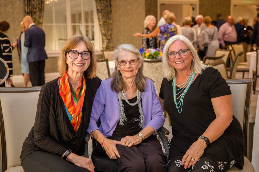 Three guests sitting together at Naples 2019